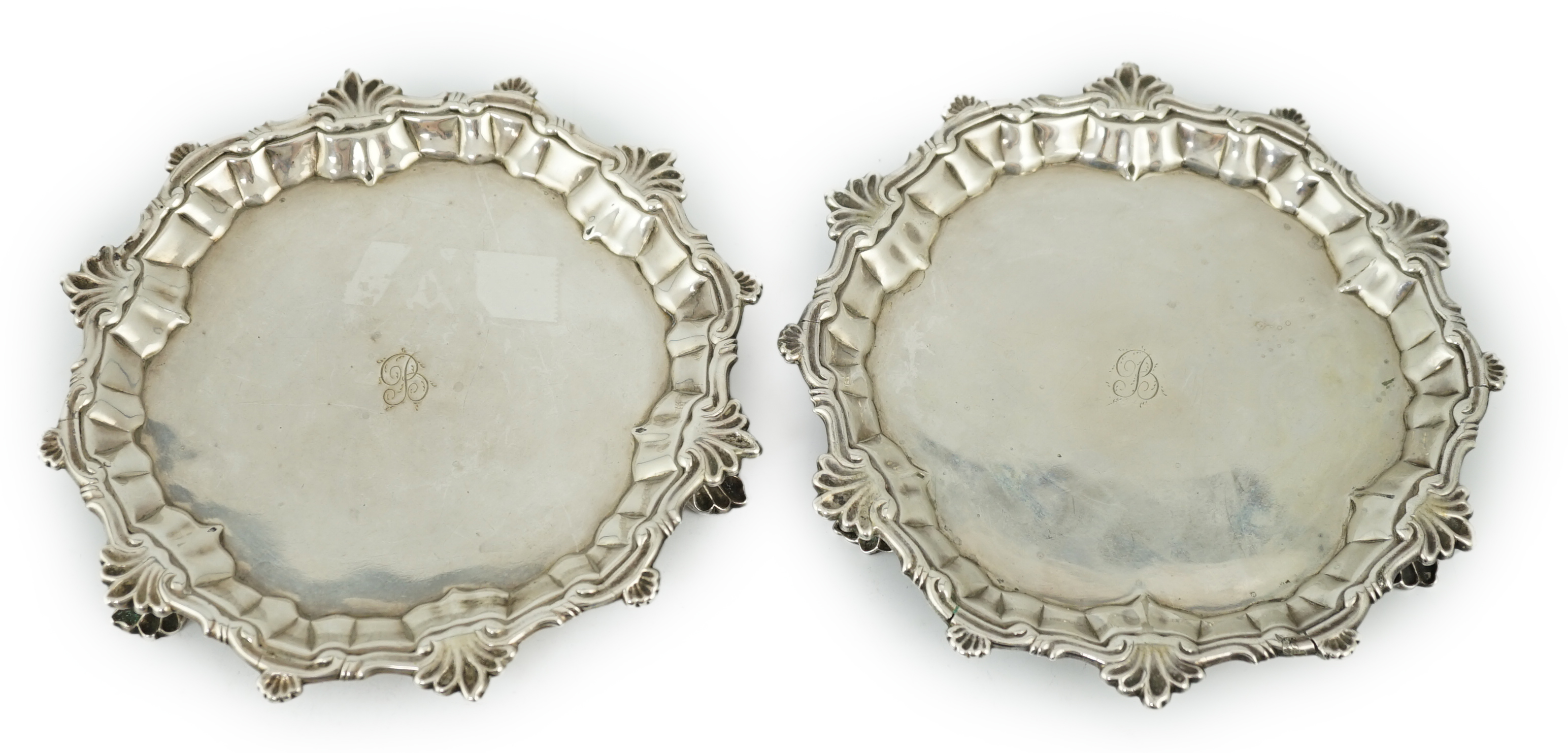 A pair of George II silver waiters, by William Peaston